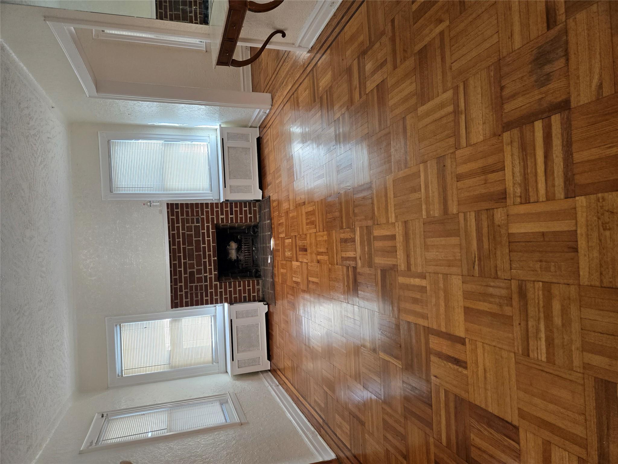 189-07 Quencer Road Queens, NY 11412 - Photo 5 of 36 a living room with a fireplace