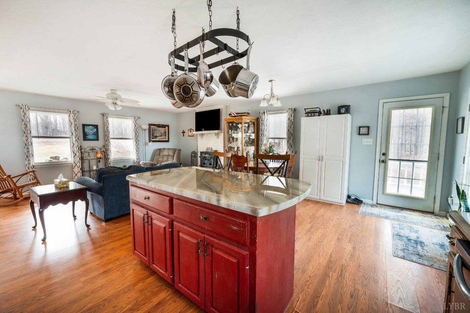 3105 Horseshoe Road Appomattox, VA 24522 - Photo 13 of 59 a kitchen with stainless steel appliances granite countertop a sink stove and wooden floor