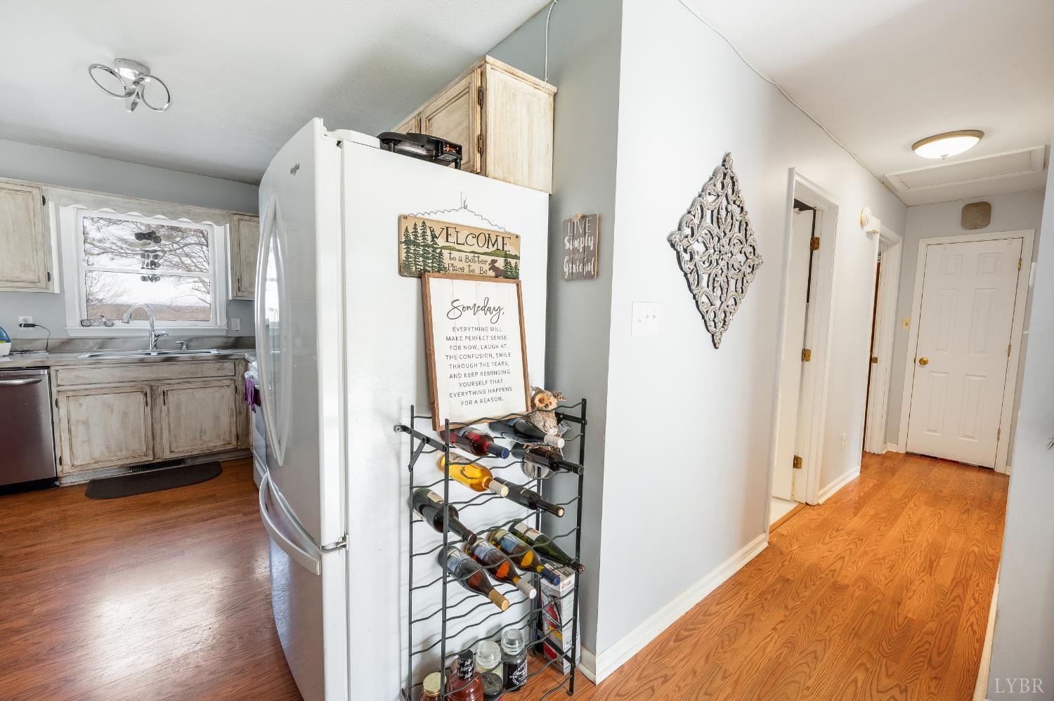 3105 Horseshoe Road Appomattox, VA 24522 - Photo 15 of 59 a view of a kitchen with fridge and wooden floor