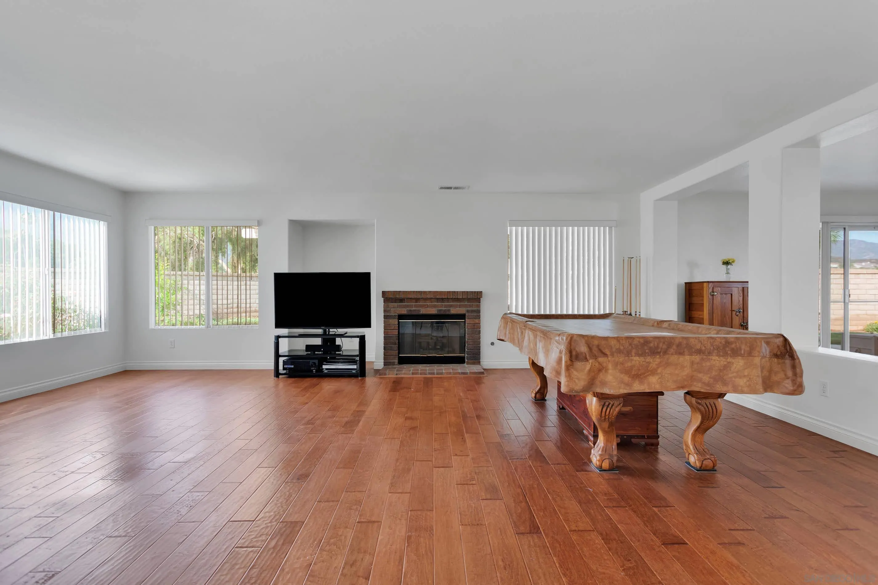3080 Nightwind Circle Corona, CA 92882 - Photo 11 of 62 a living room with furniture and a flat screen tv
