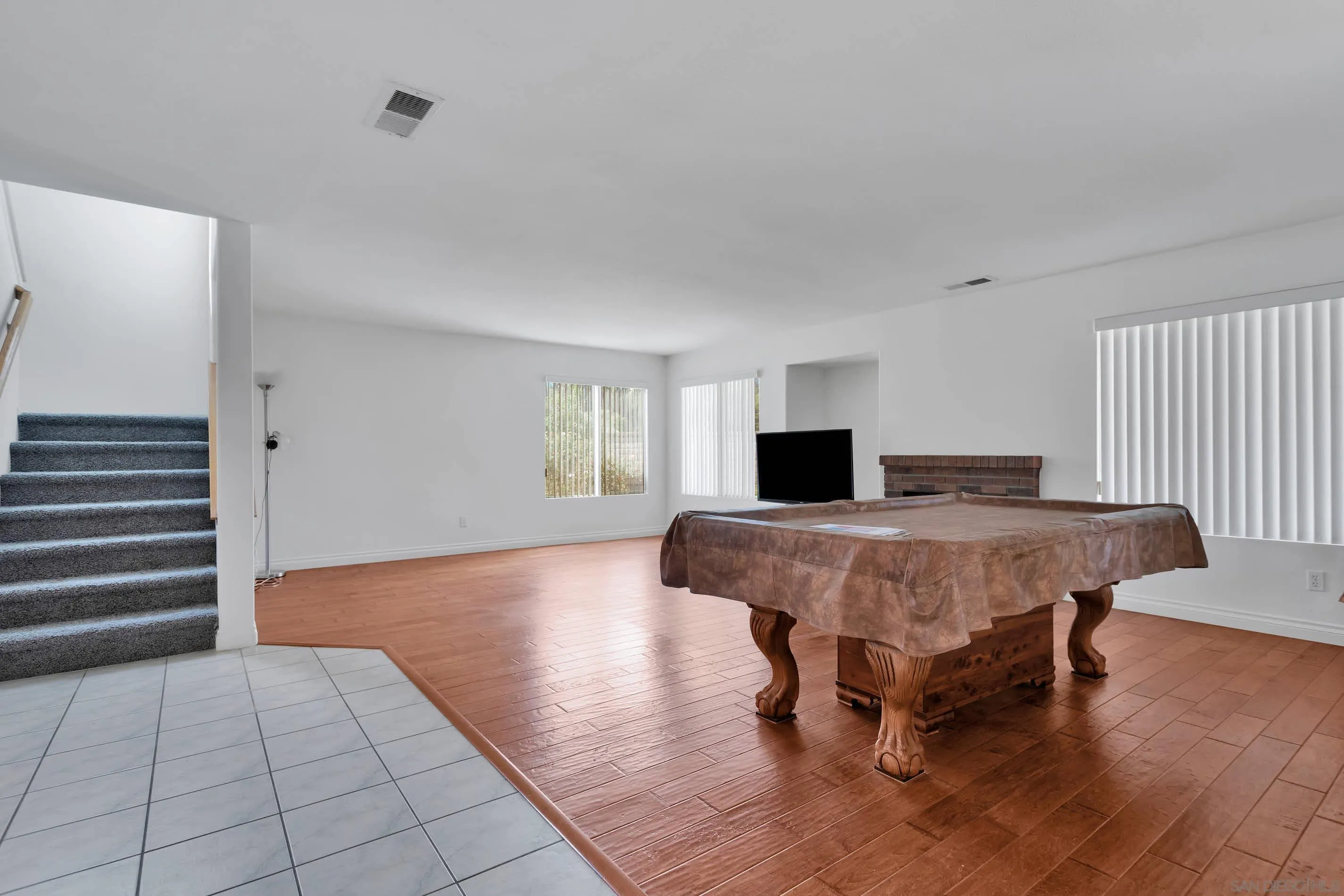 3080 Nightwind Circle Corona, CA 92882 - Photo 12 of 62 a bedroom with a bed and wooden floor