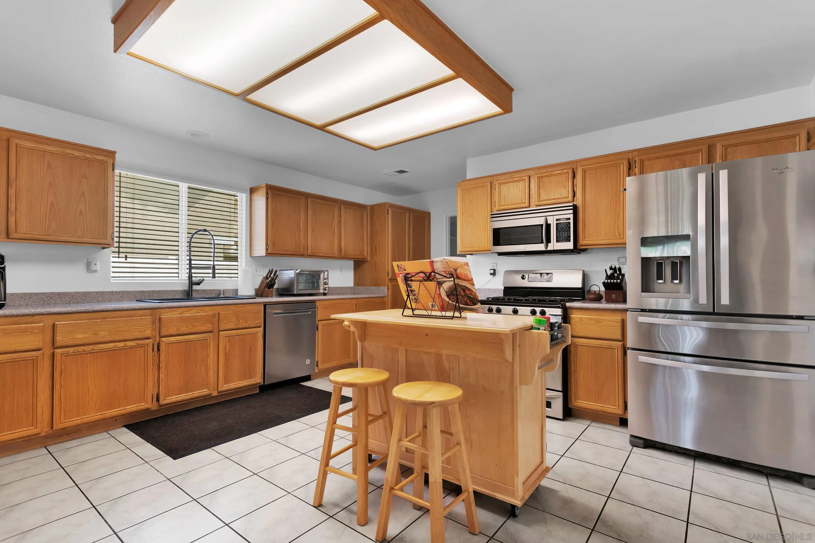 3080 Nightwind Circle Corona, CA 92882 - Photo 15 of 62 a kitchen with stainless steel appliances granite countertop a refrigerator stove microwave and sink