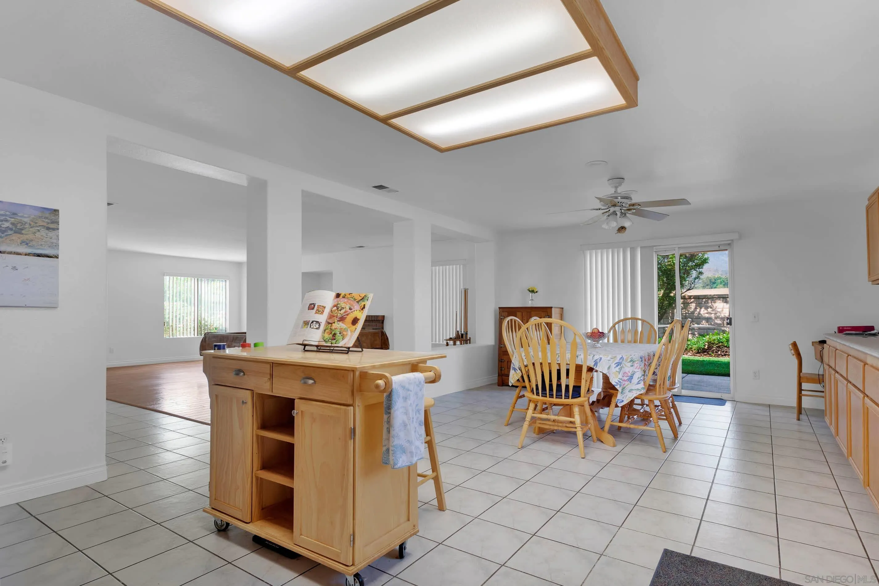 3080 Nightwind Circle Corona, CA 92882 - Photo 17 of 62 a dining room filled chandelier and kitchen view