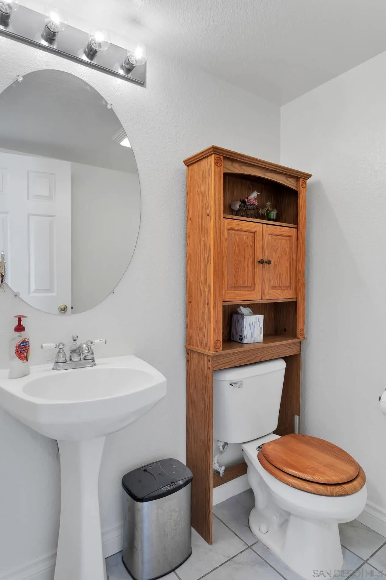 3080 Nightwind Circle Corona, CA 92882 - Photo 21 of 62 a bathroom with a sink toilet and mirror