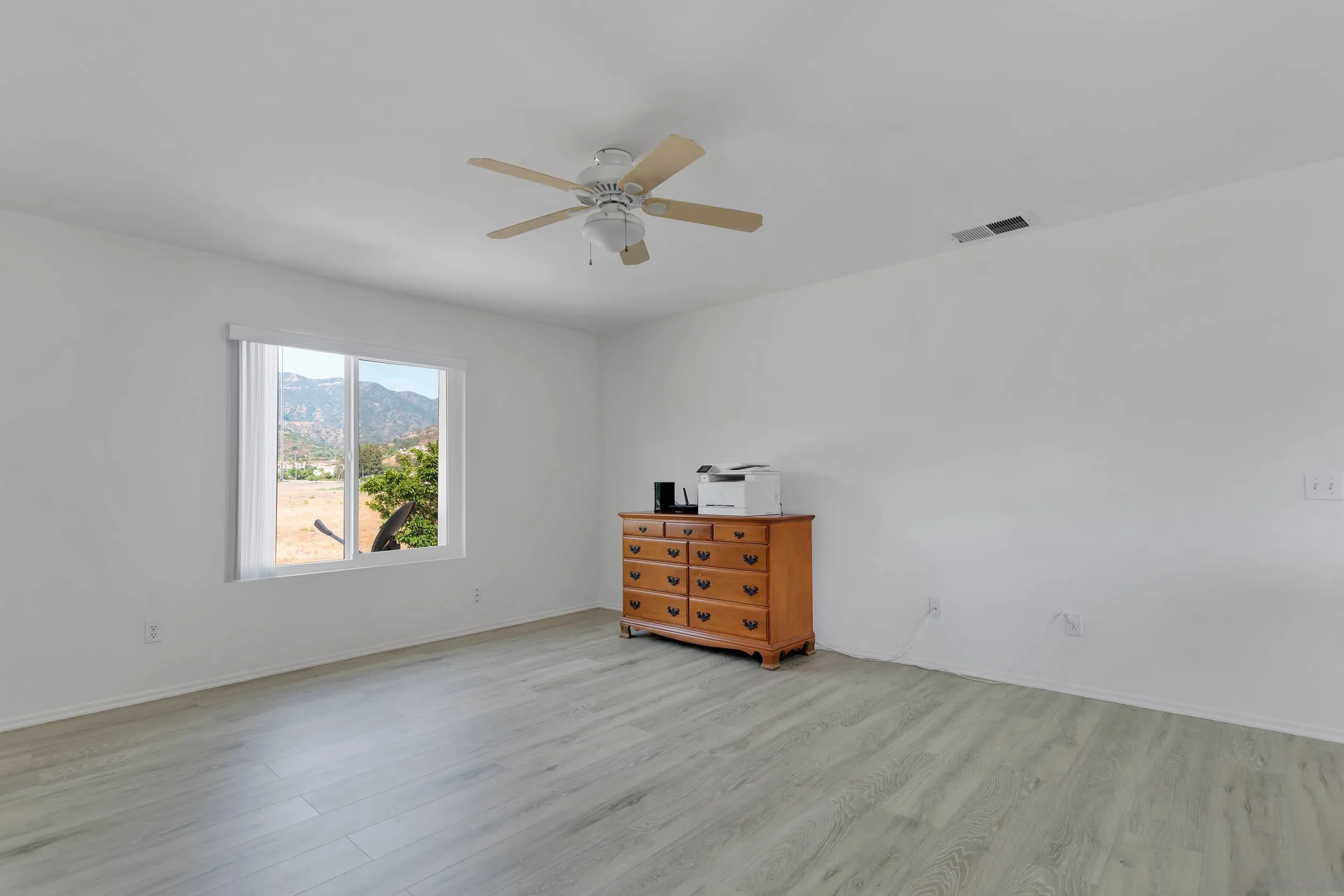 3080 Nightwind Circle Corona, CA 92882 - Photo 28 of 62 wooden floor in an empty room with a window