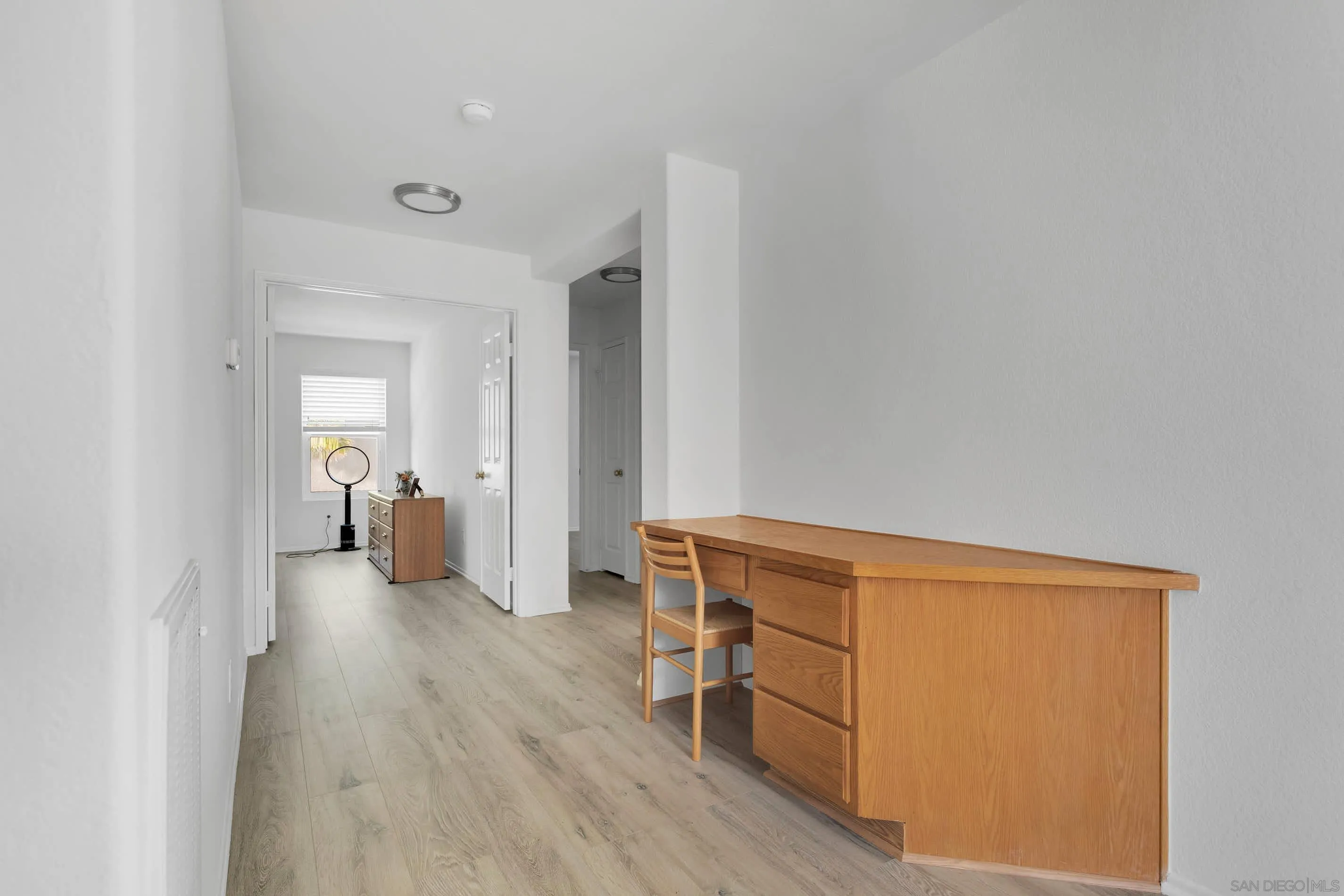 3080 Nightwind Circle Corona, CA 92882 - Photo 31 of 62 a view of a bedroom with furniture and wooden floor