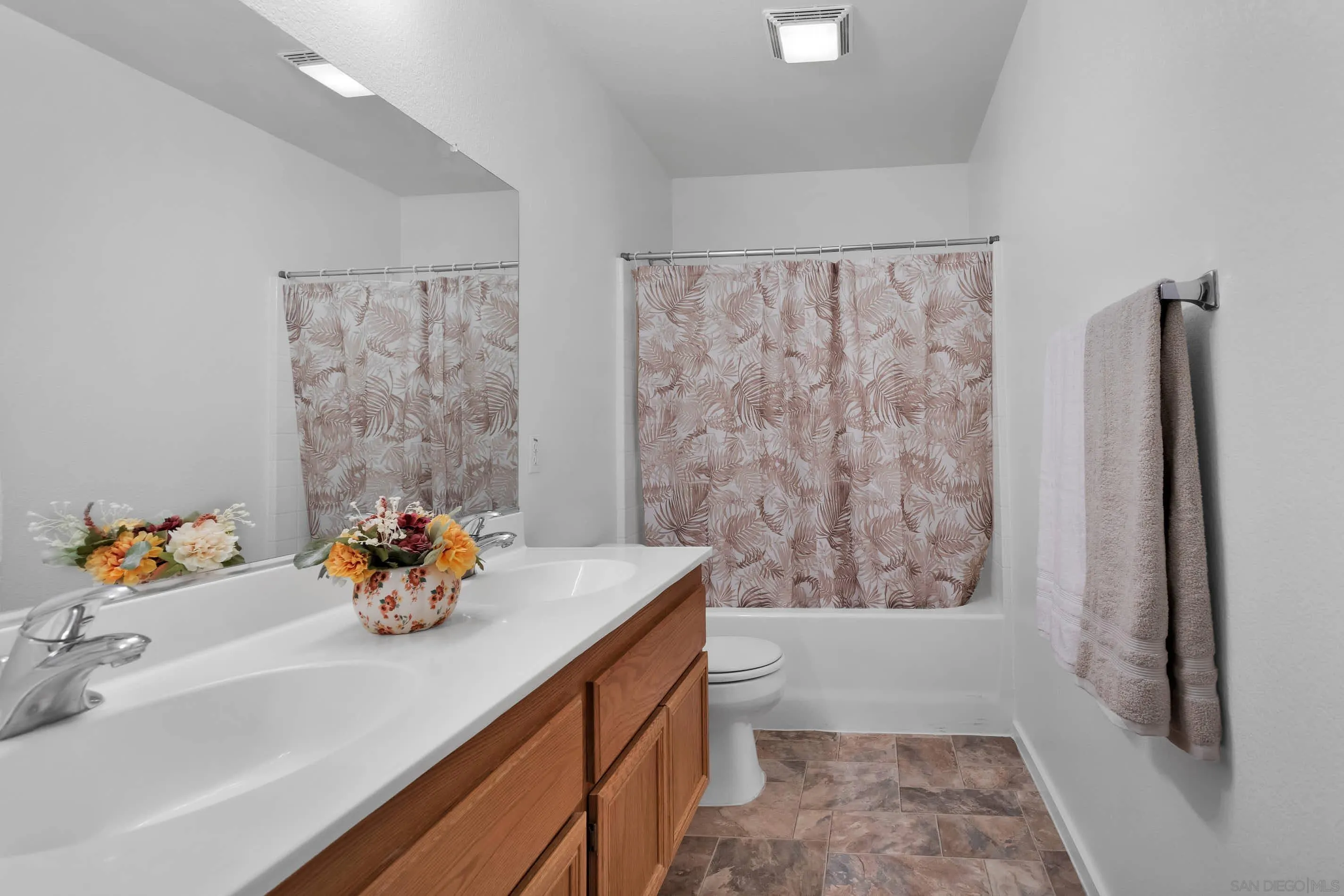 3080 Nightwind Circle Corona, CA 92882 - Photo 34 of 62 a bathroom with a sink a toilet and shower