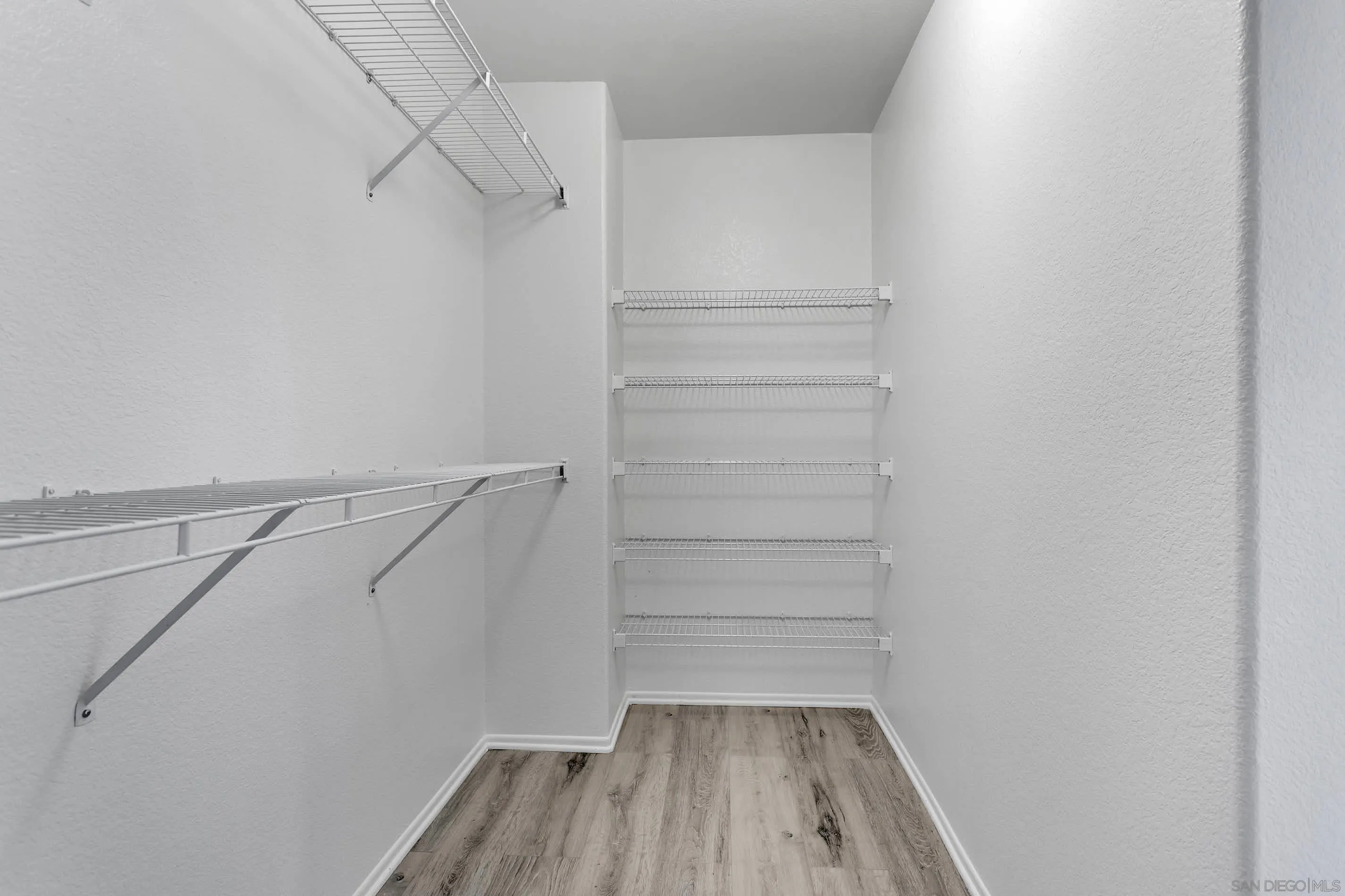 3080 Nightwind Circle Corona, CA 92882 - Photo 37 of 62 a view of walk in closet with empty racks