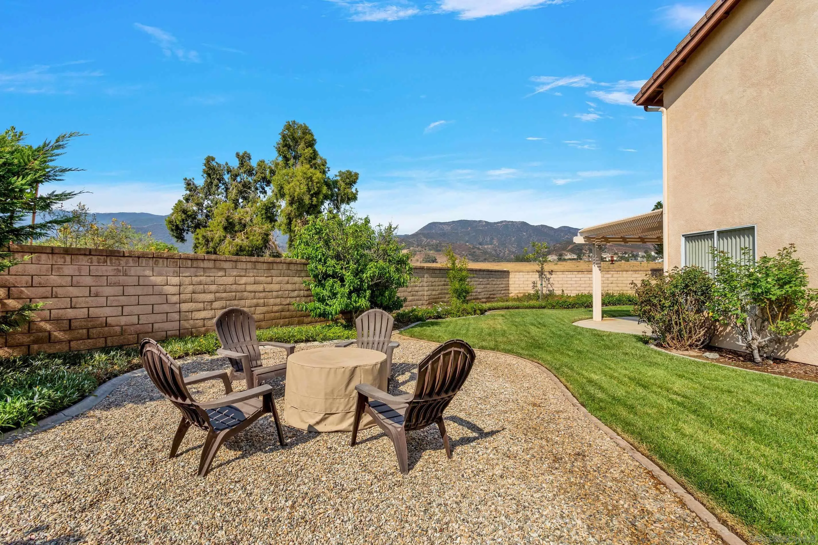 3080 Nightwind Circle Corona, CA 92882 - Photo 46 of 62 a view of a chairs and table in the garden
