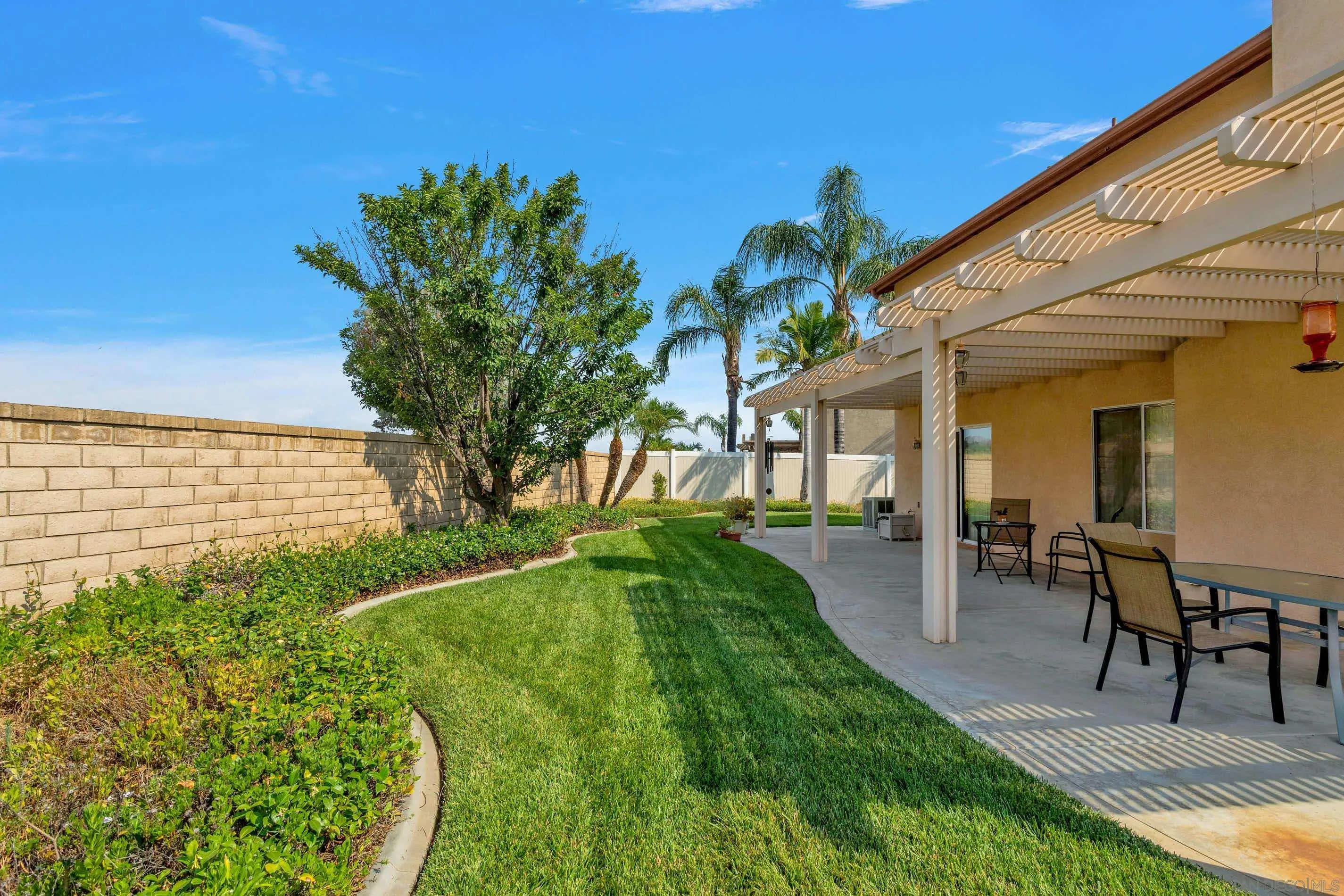 3080 Nightwind Circle Corona, CA 92882 - Photo 49 of 62 a view of a patio with table and chairs and potted plants