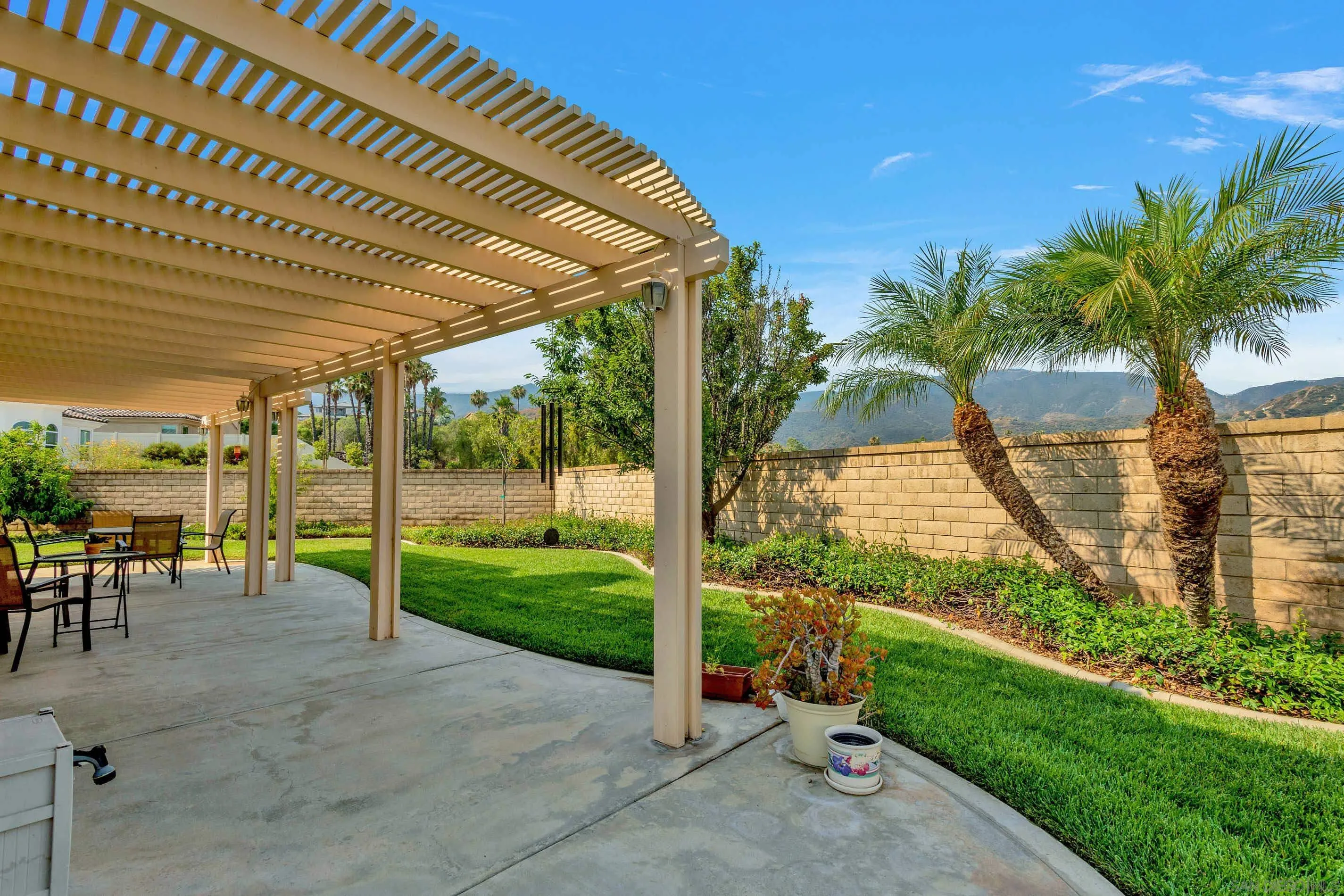 3080 Nightwind Circle Corona, CA 92882 - Photo 50 of 62 a view of a porch with furniture and garden