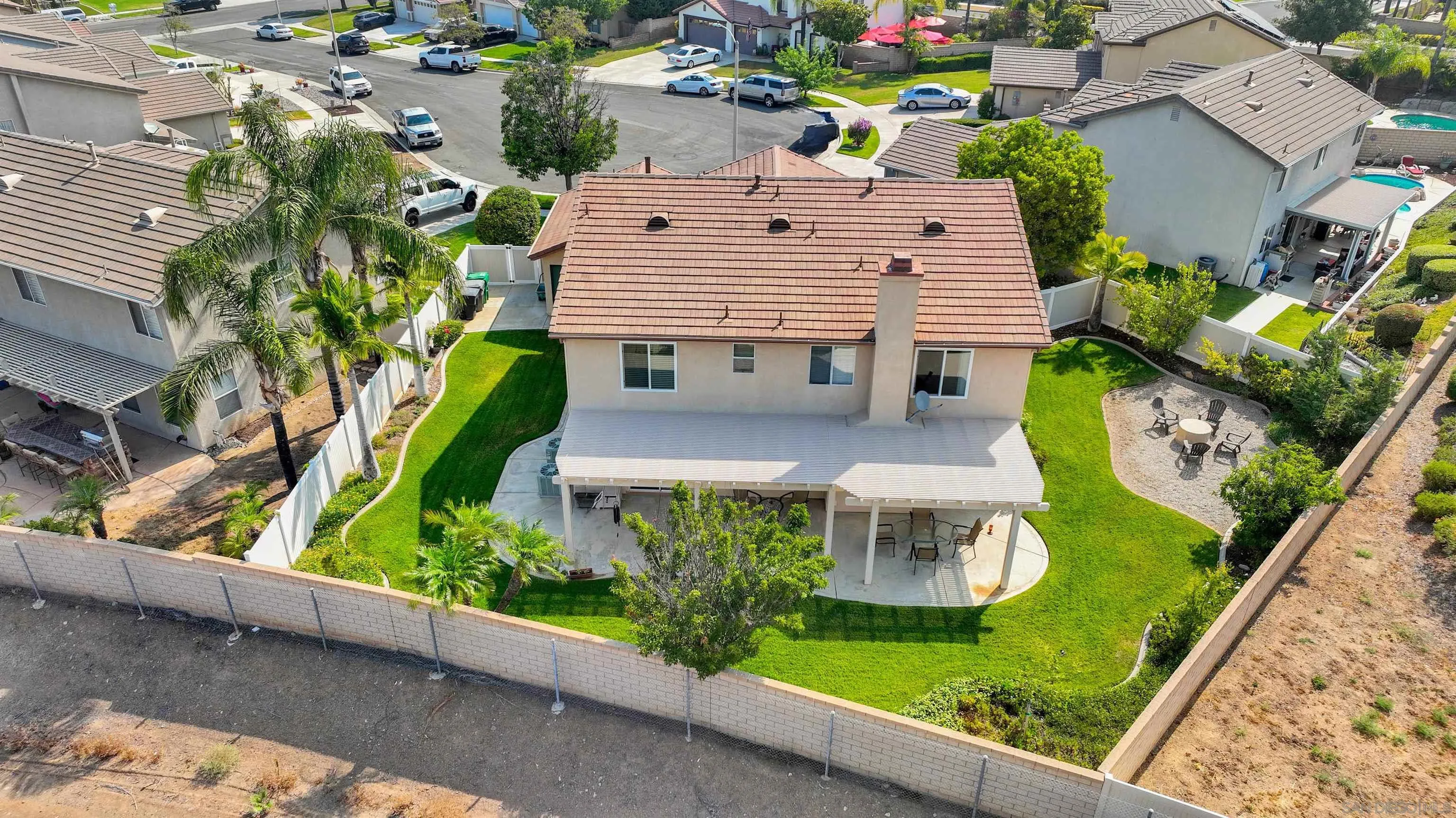 3080 Nightwind Circle Corona, CA 92882 - Photo 57 of 62 an aerial view of a house with a garden and plants