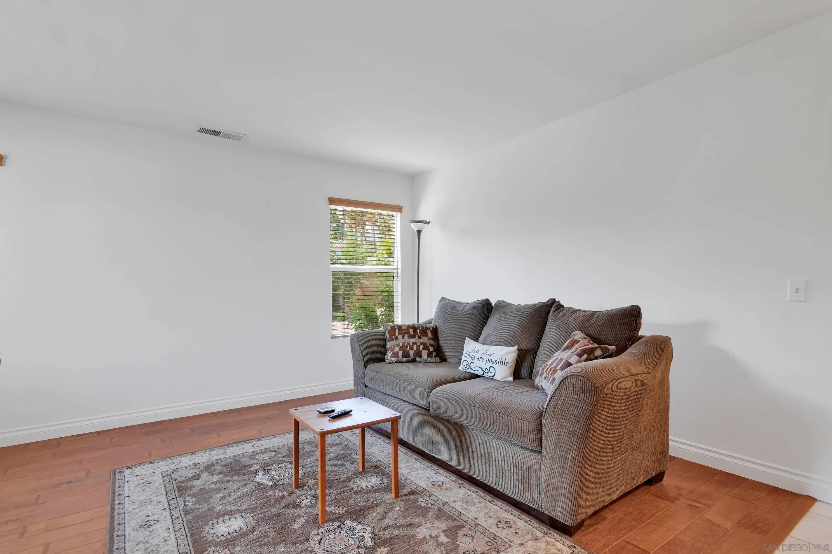 3080 Nightwind Circle Corona, CA 92882 - Photo 9 of 62 a living room with furniture and a window