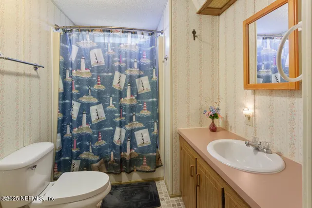 a front view of a house with porch and garden