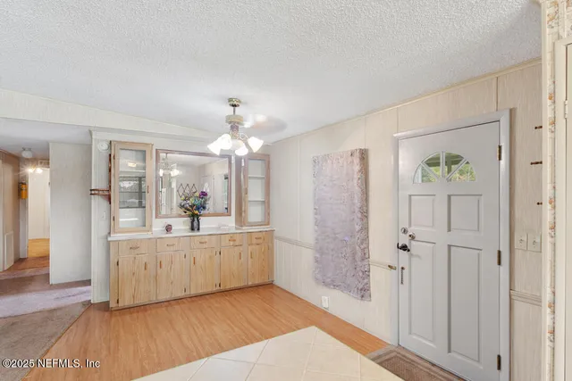 a kitchen with green cabinets a sink and a stove