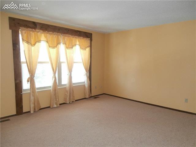 2870 Valencia Road Colorado Springs, CO 80917 - Photo 14 of 20 Another upper level bedroom with spacious closets
