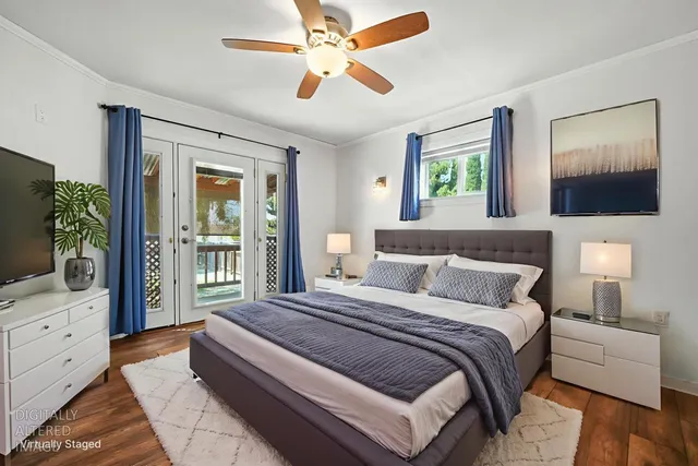 an empty room with fan and windows