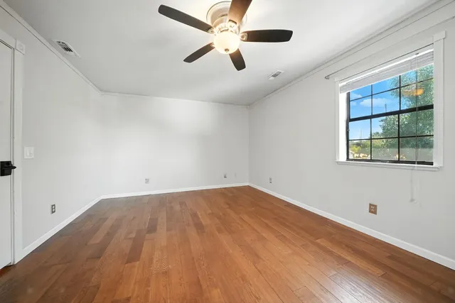 an aerial view of multiple houses with yard