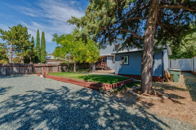 a house view with a outdoor seating