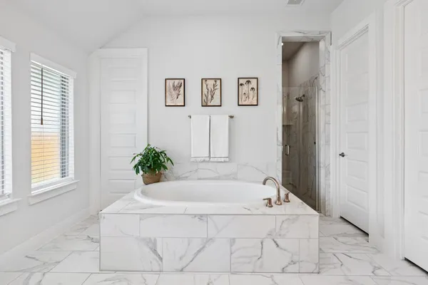 a bedroom with furniture and a flat screen tv