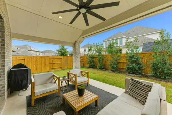 a view of a patio with a table chairs and a table
