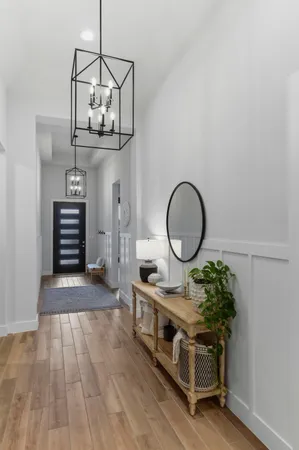 a view of room with furniture and wooden floor