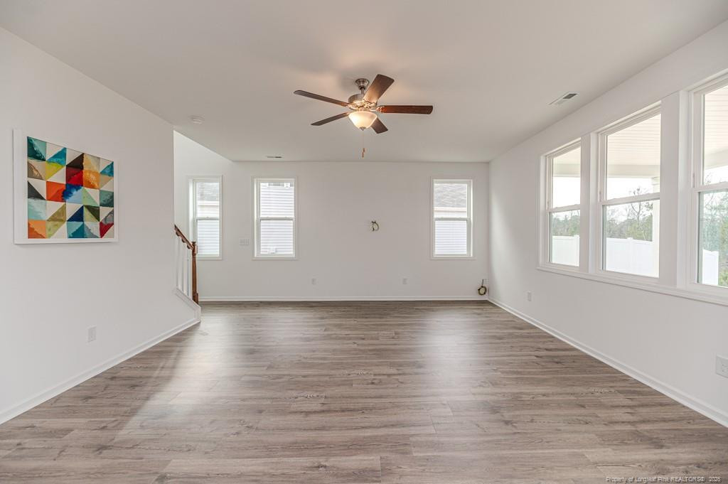 175 Marlborough Street Raeford, NC 28376 - Photo 5 of 22 wooden floor in an empty room with a window