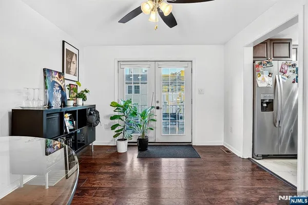 a view of a livingroom with furniture and a potted plant