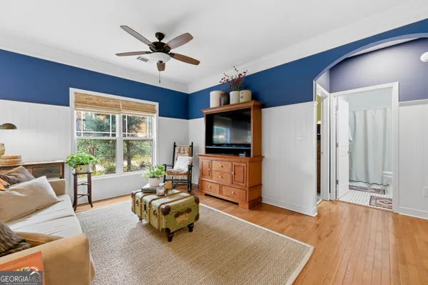 a living room with furniture and a flat screen tv