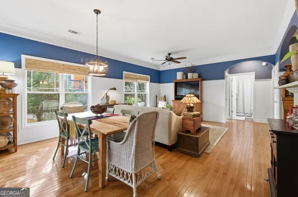 a view of a dining room with furniture window and wooden floor