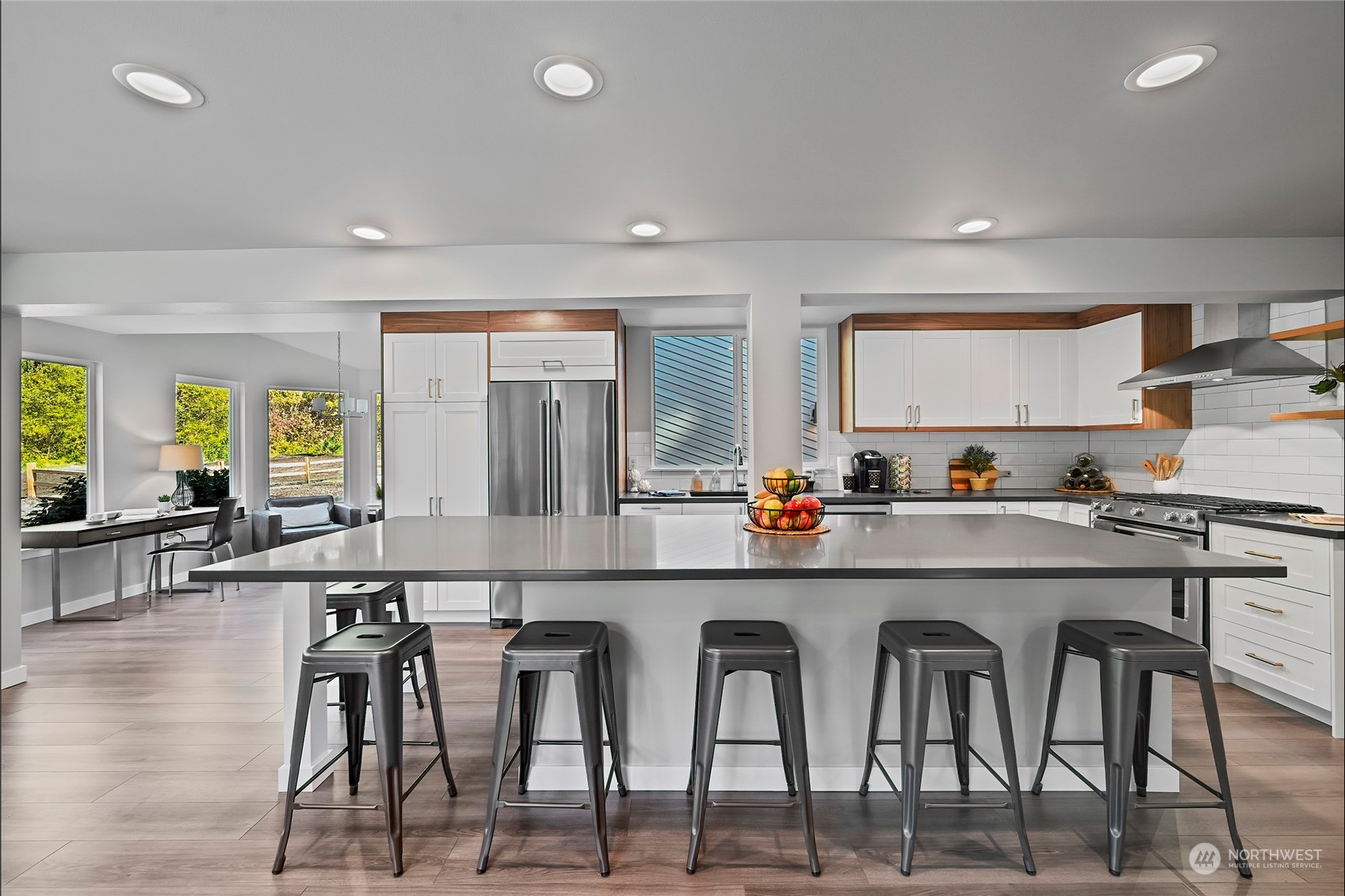 23026 30th Drive Southeast Bothell, WA 98021 - Photo 11 of 40 a kitchen with chairs and white cabinets