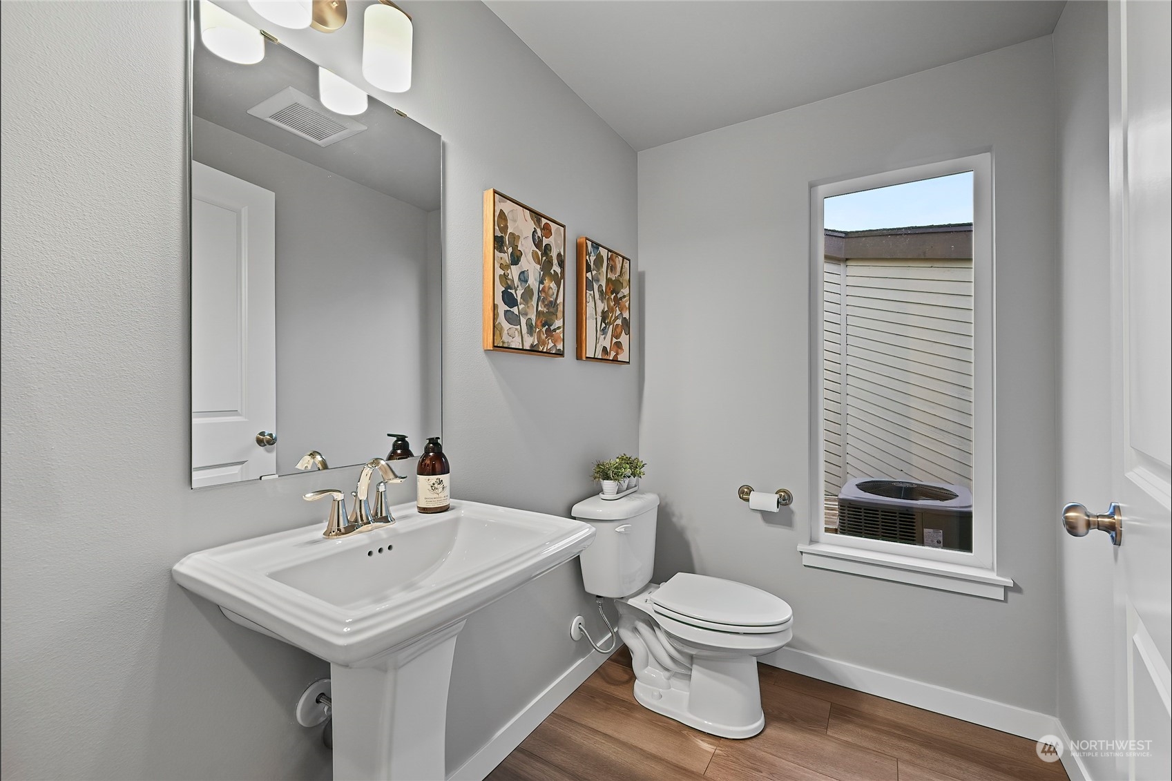 23026 30th Drive Southeast Bothell, WA 98021 - Photo 13 of 40 a bathroom with a toilet a sink and a mirror