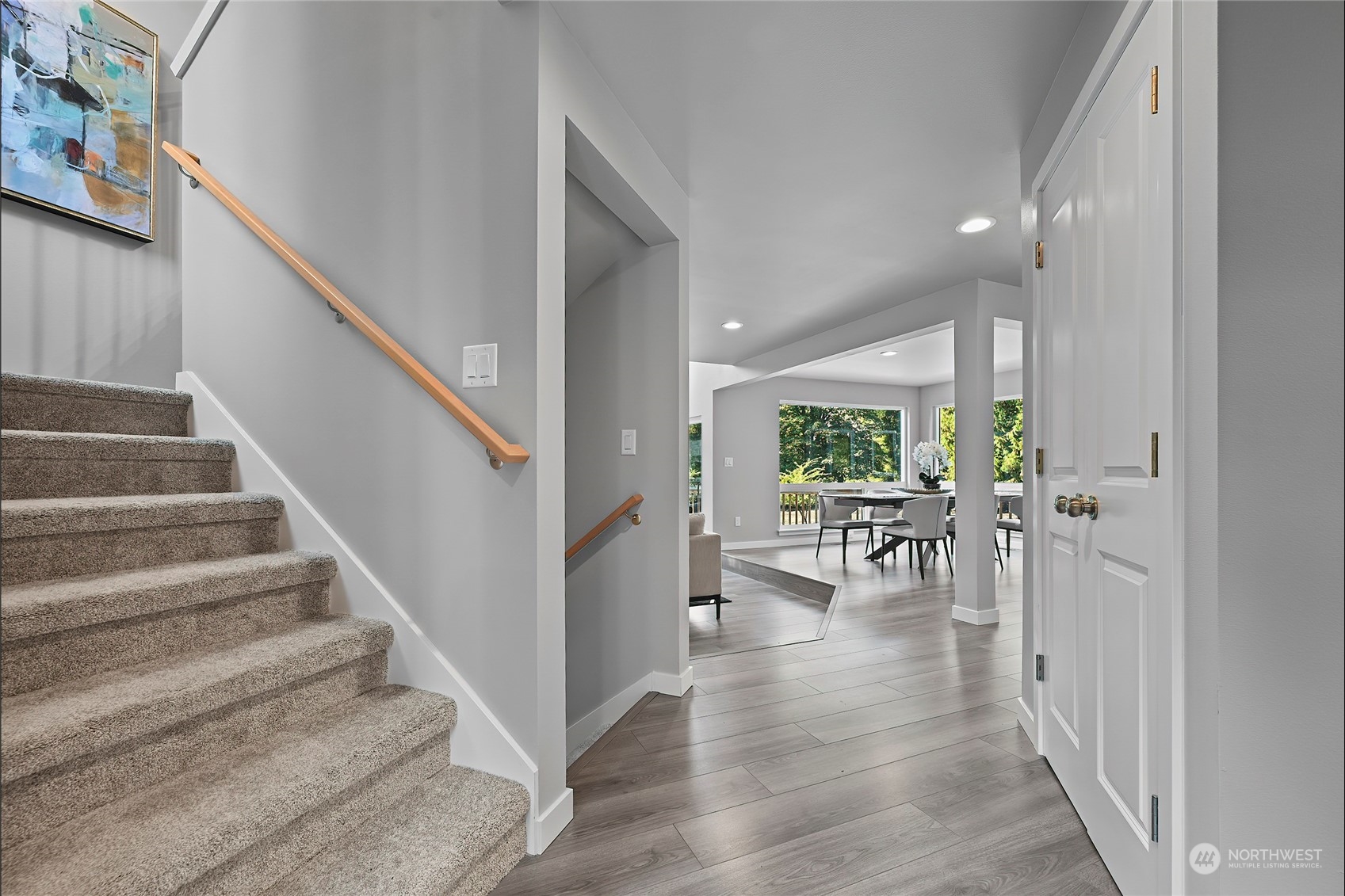 23026 30th Drive Southeast Bothell, WA 98021 - Photo 17 of 40 a view of an entryway with wooden floor and a livingroom