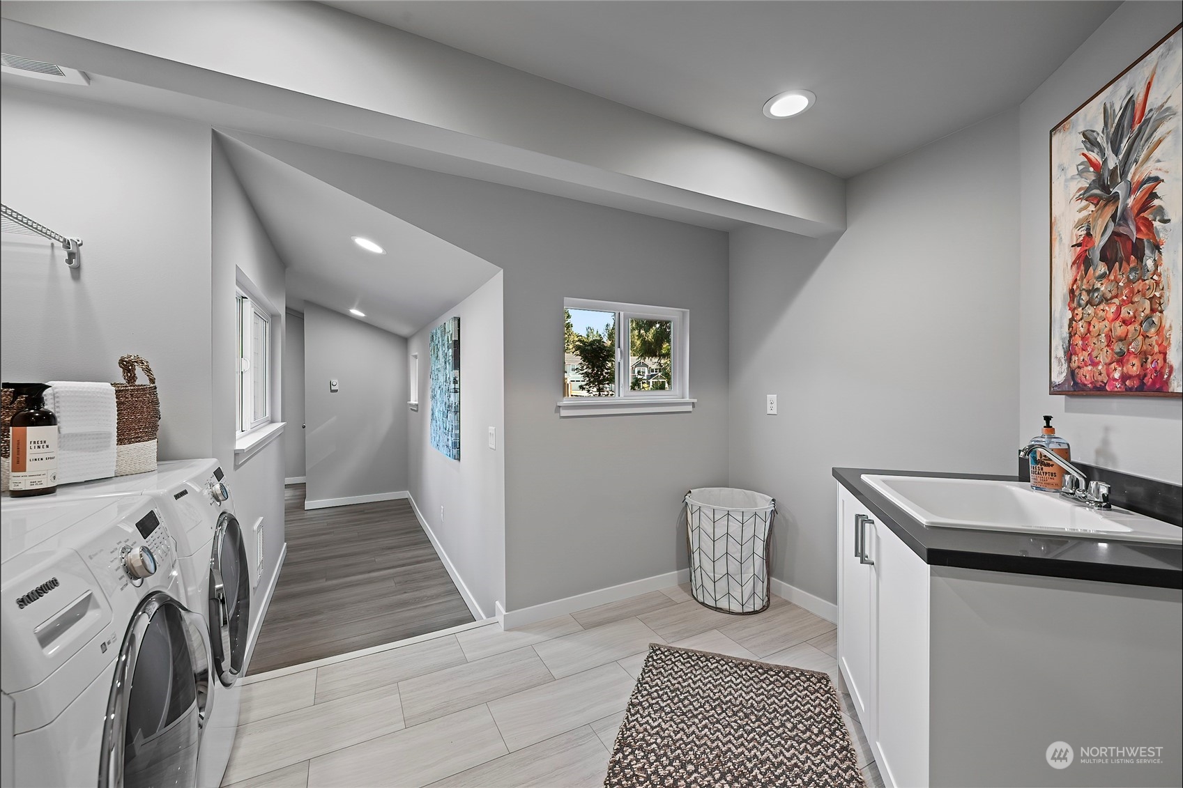 23026 30th Drive Southeast Bothell, WA 98021 - Photo 18 of 40 a kitchen with granite countertop a sink and a stove top oven