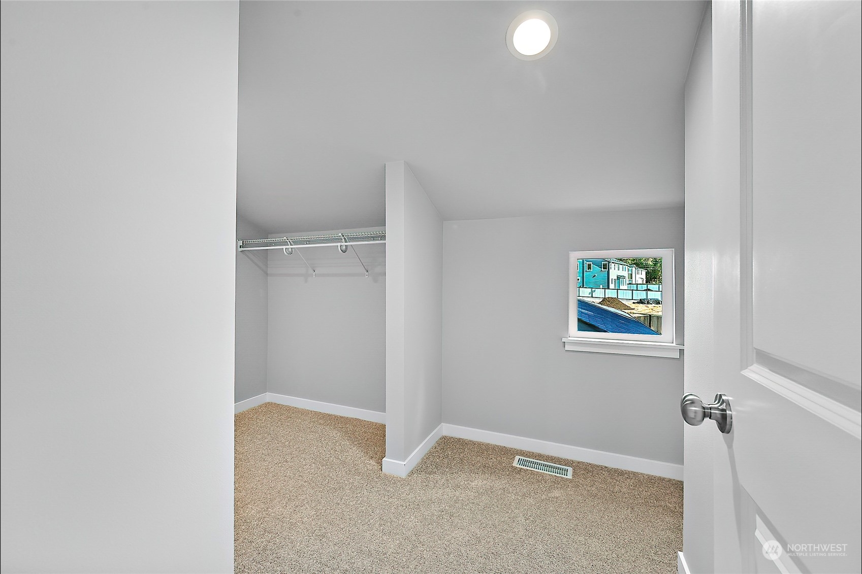 23026 30th Drive Southeast Bothell, WA 98021 - Photo 21 of 40 a view of an empty room with closet and a window