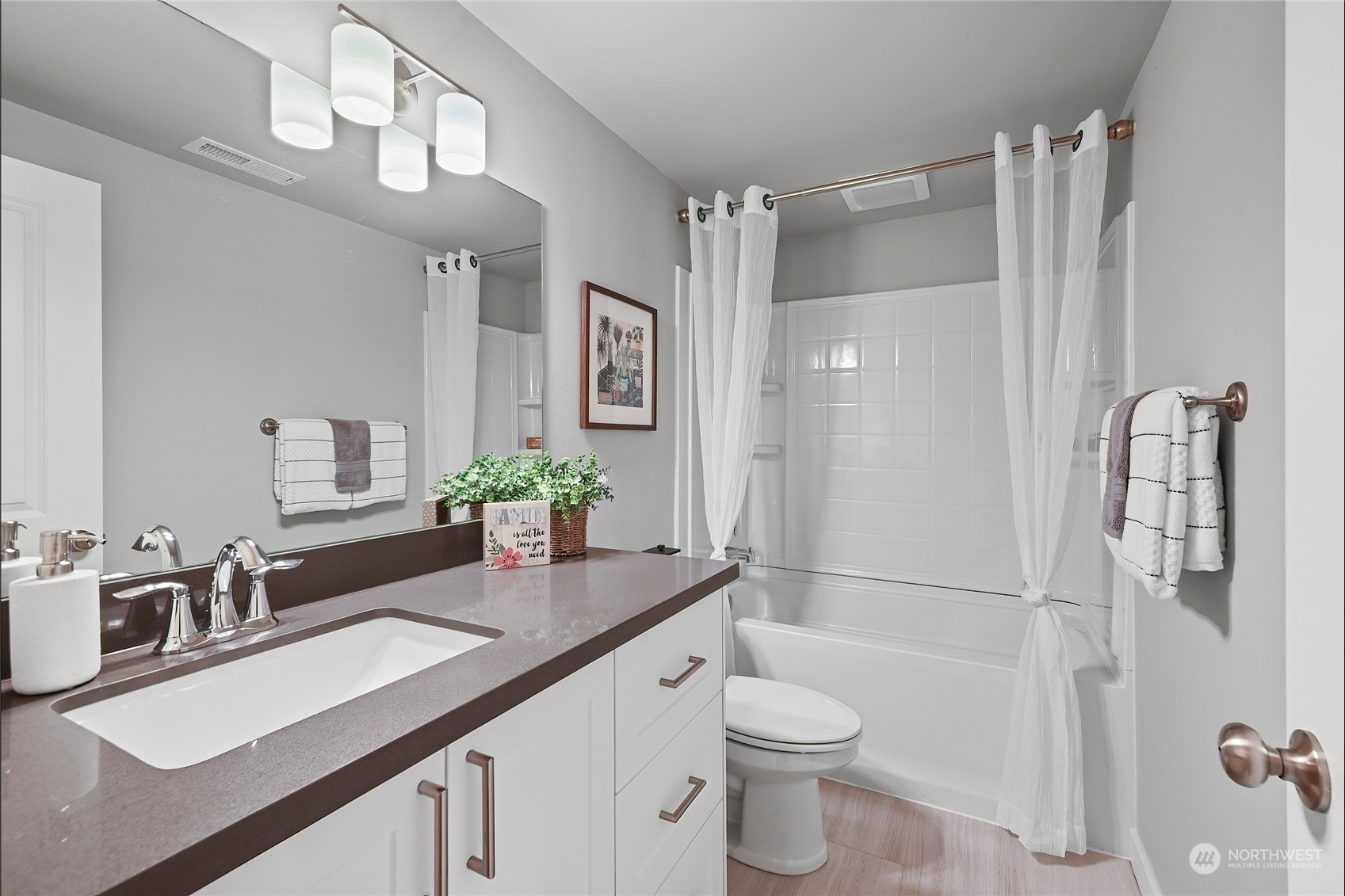 23026 30th Drive Southeast Bothell, WA 98021 - Photo 25 of 40 a bathroom with a sink a toilet and shower