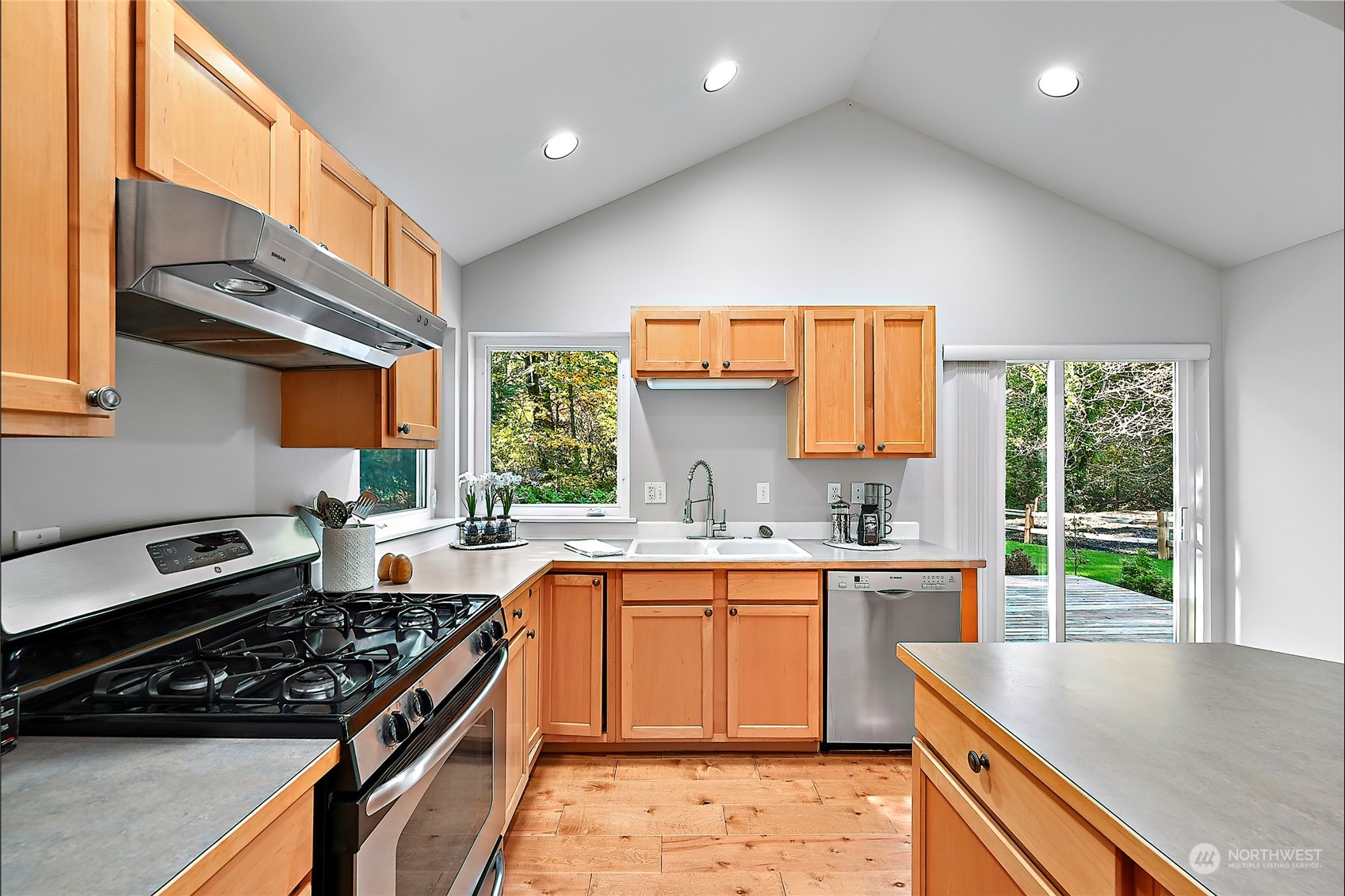 23026 30th Drive Southeast Bothell, WA 98021 - Photo 40 of 40 a kitchen with a sink stove top oven and cabinets