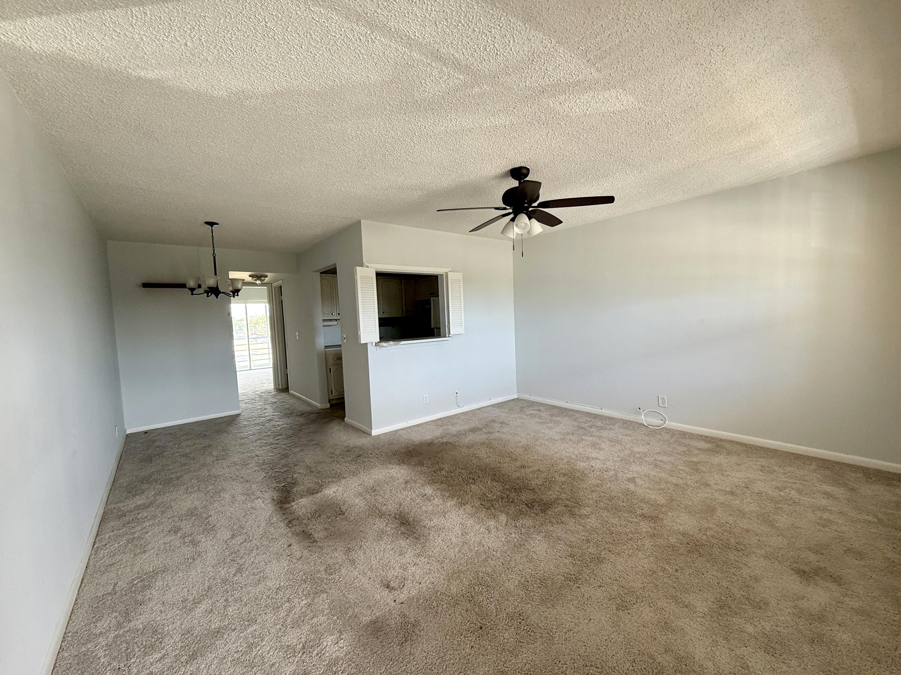 179 Northampton I West Palm Beach, FL 33417 - Photo 2 of 12 a view of empty room with windows