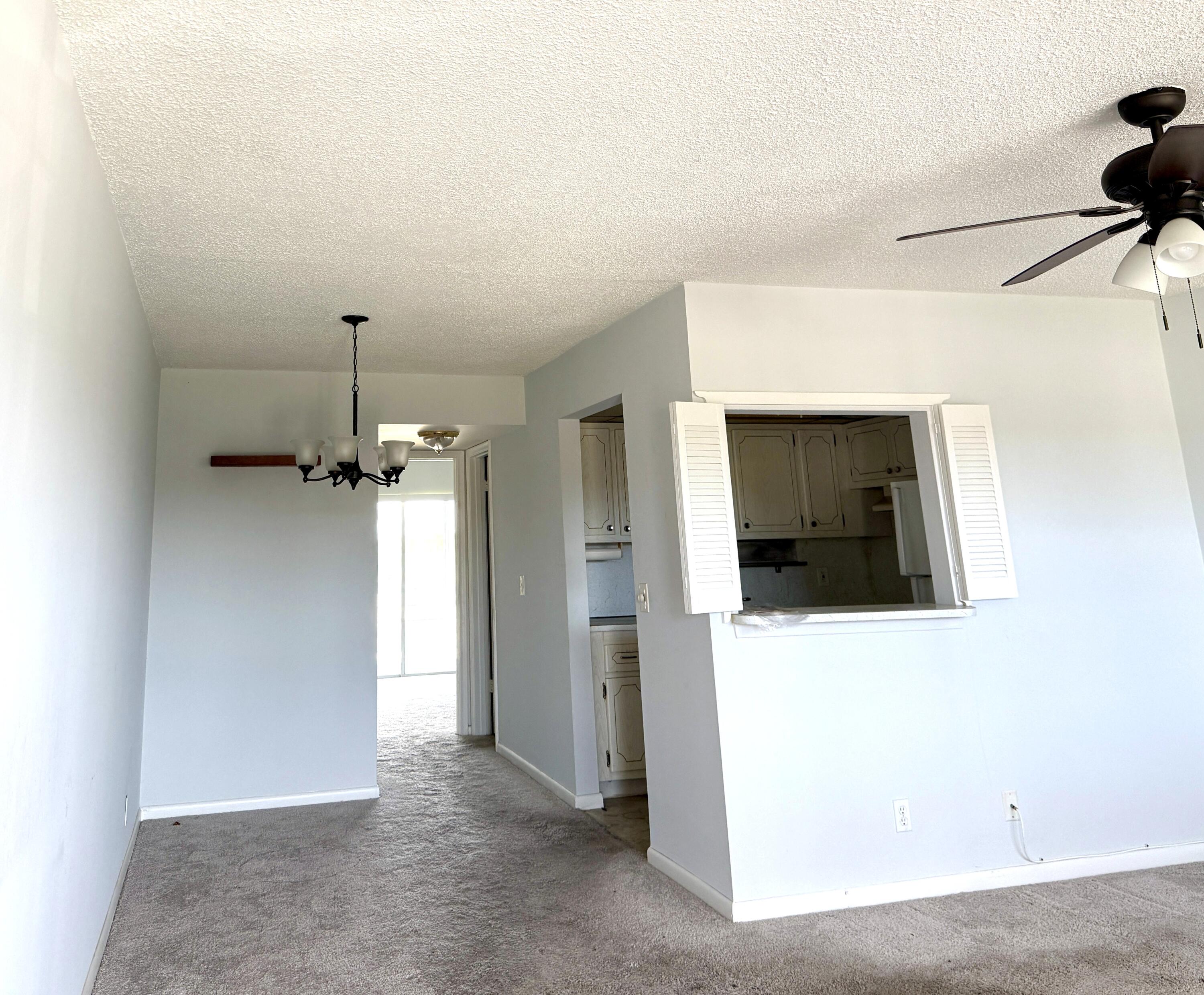179 Northampton I West Palm Beach, FL 33417 - Photo 4 of 12 a view of a livingroom with a fireplace