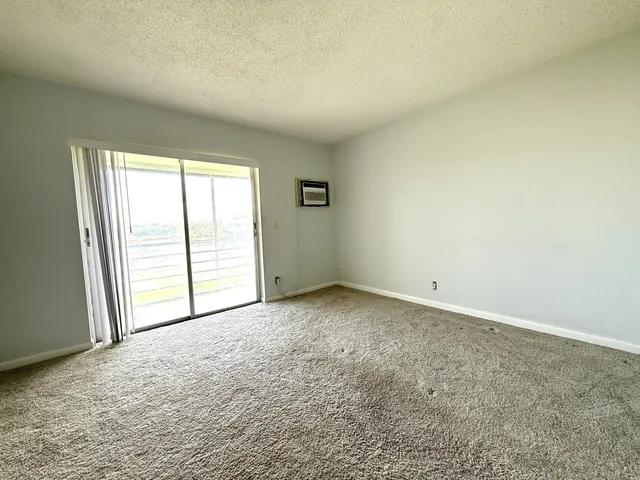 a view of a living room with windows