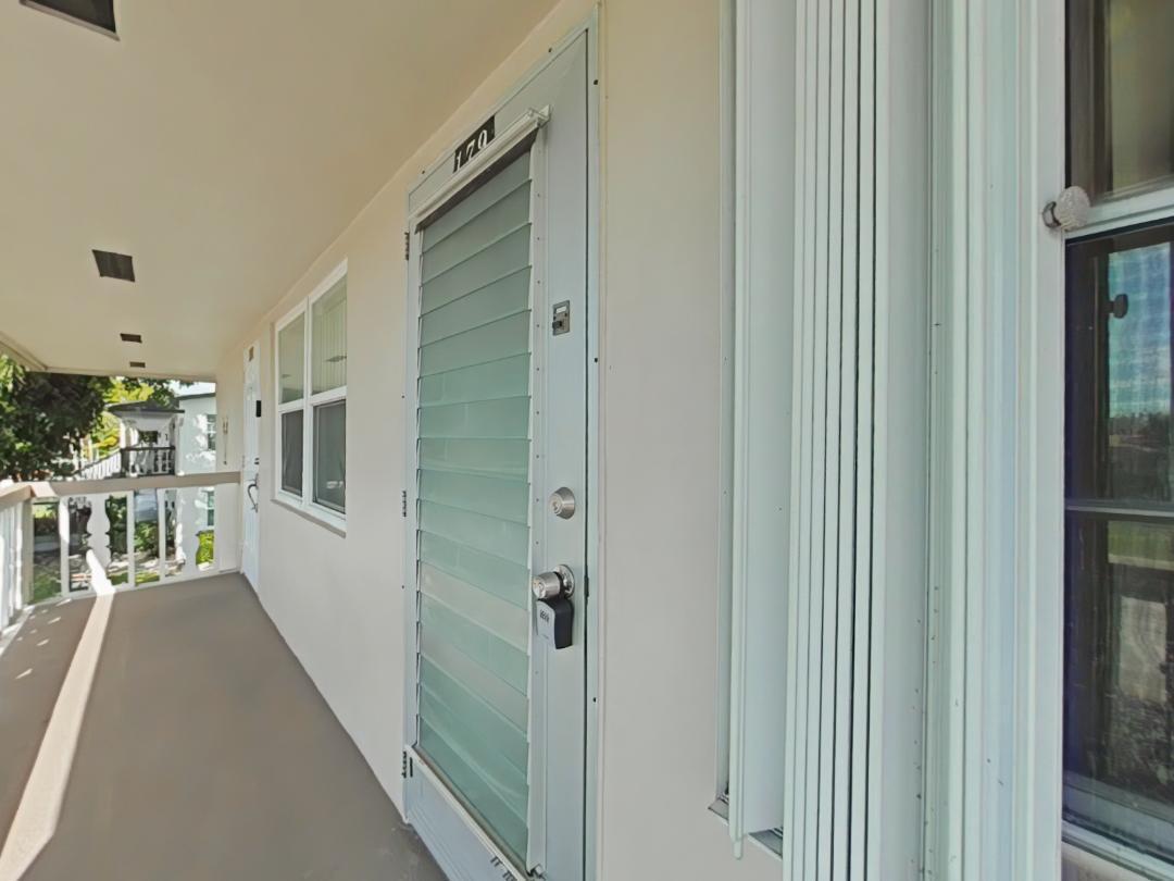 179 Northampton I West Palm Beach, FL 33417 - Photo 7 of 12 a view of a living room with windows