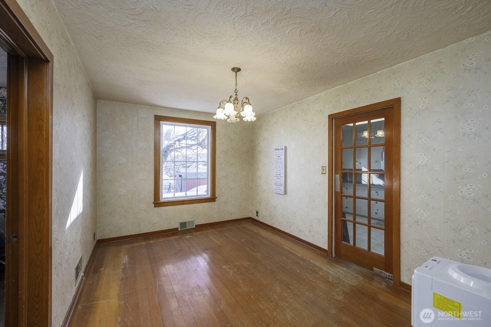 32244 Mohler Road East Mohler, WA 99154 - Photo 15 of 35 a view of an empty room with a window and wooden floor