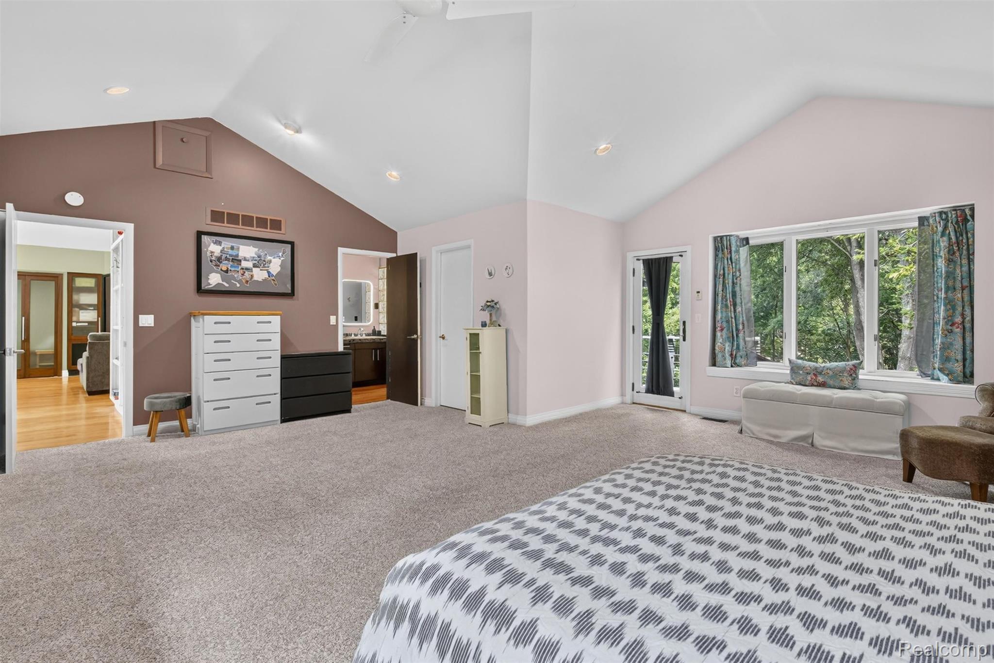 9319 Faussett Road Fenton, MI 48430 - Photo 28 of 70 Vaulted ceilings with recessed lighting, wall-to-wall carpeting, and a large bay window with an integrated bench seat