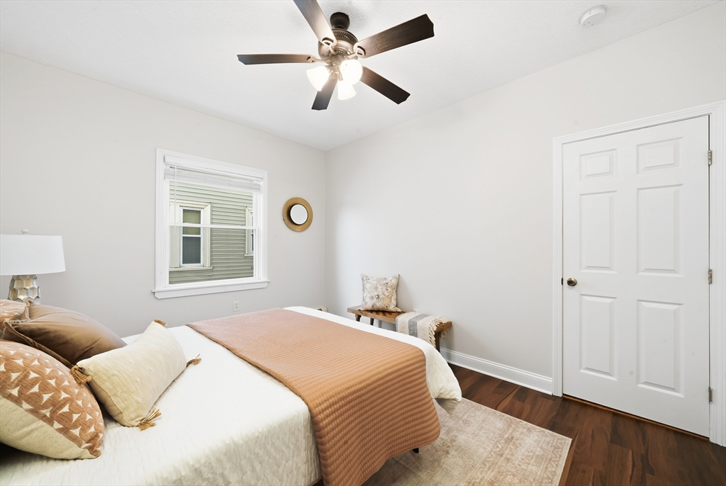 8 Humboldt Avenue, Unit 2 Boston, MA 02119 - Photo 11 of 39 a bedroom with a bed and a window