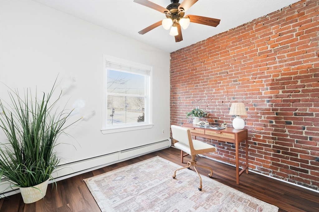 8 Humboldt Avenue, Unit 2 Boston, MA 02119 - Photo 26 of 39 a view of a livingroom with furniture and a potted plant