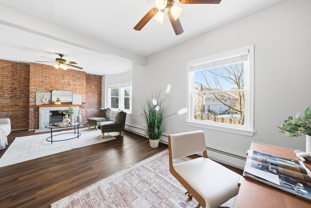 8 Humboldt Avenue, Unit 2 Boston, MA 02119 - Photo 29 of 39 a living room with furniture a rug and a potted plant