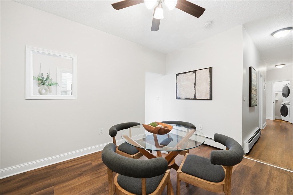 8 Humboldt Avenue, Unit 2 Boston, MA 02119 - Photo 30 of 39 a dining room with furniture and wooden floor