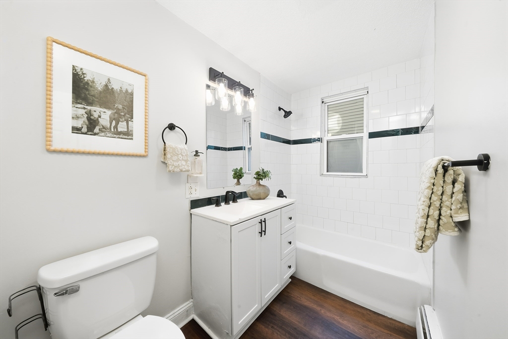 8 Humboldt Avenue, Unit 2 Boston, MA 02119 - Photo 33 of 39 a bathroom with a sink toilet and bathtub