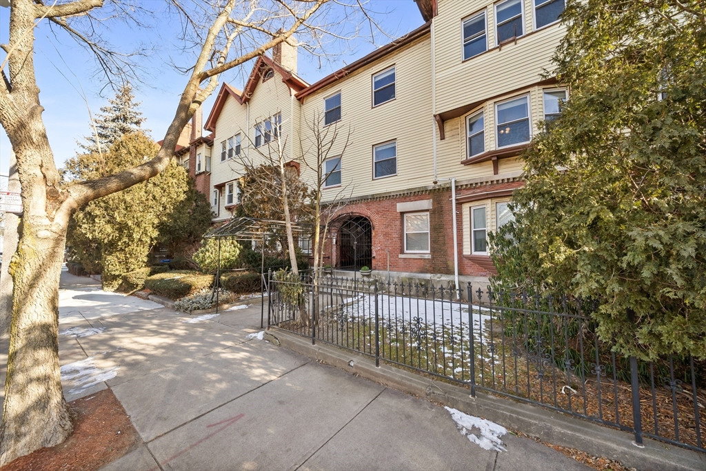 8 Humboldt Avenue, Unit 2 Boston, MA 02119 - Photo 36 of 39 a view of a brick house with many windows