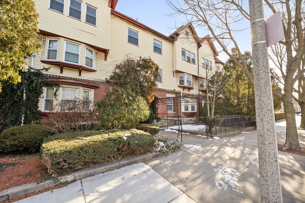 8 Humboldt Avenue, Unit 2 Boston, MA 02119 - Photo 38 of 39 a view of a building with a yard